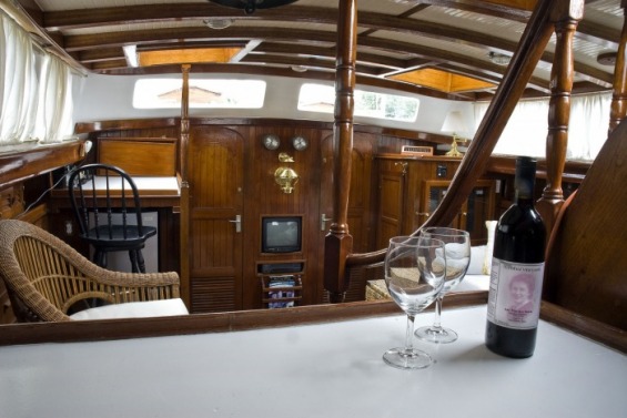 sailboat interior, bar, salon, wine and glasses