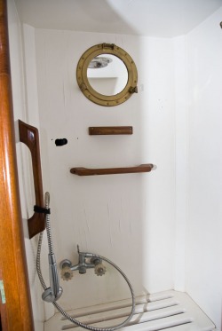sailboat interior, shower, teak trim