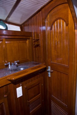 sailboat interior, head, teak cabinetry