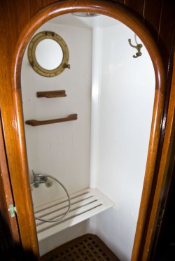 sailboat interior, shower, teak trim